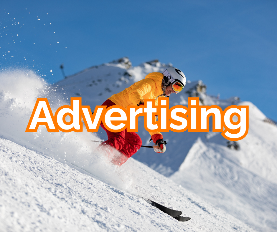 Skiing down the hill in a yellow jacket and red trousers with the word advertising on the page